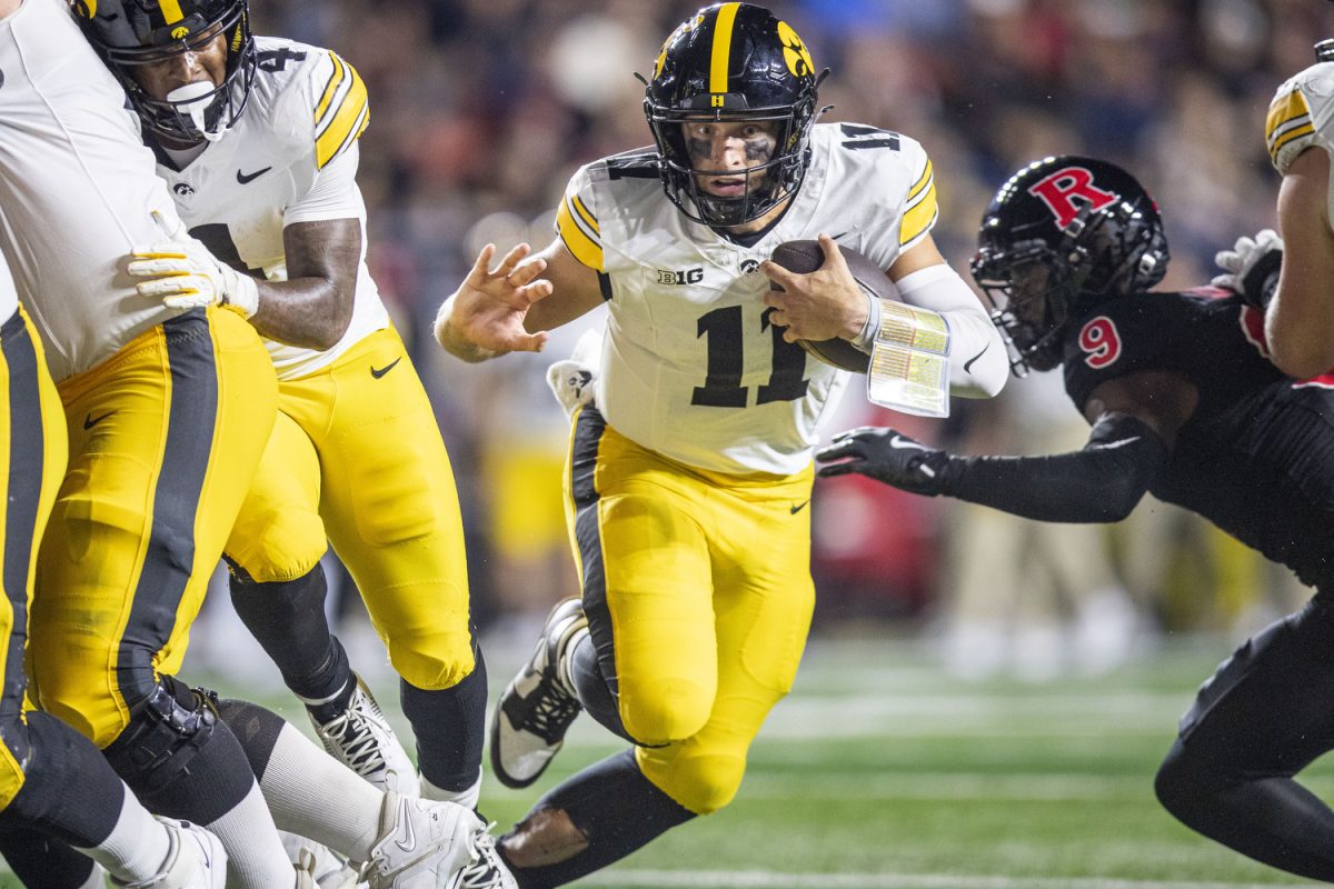 Iowa quarterback Mark Gronowski carries the ball into the end zone during a football game between Iowa and Rutgers at SHI Stadium in Piscataway, N.J. on Sept. 19, 2025. (Cody Blissett / The Daily Iowan)