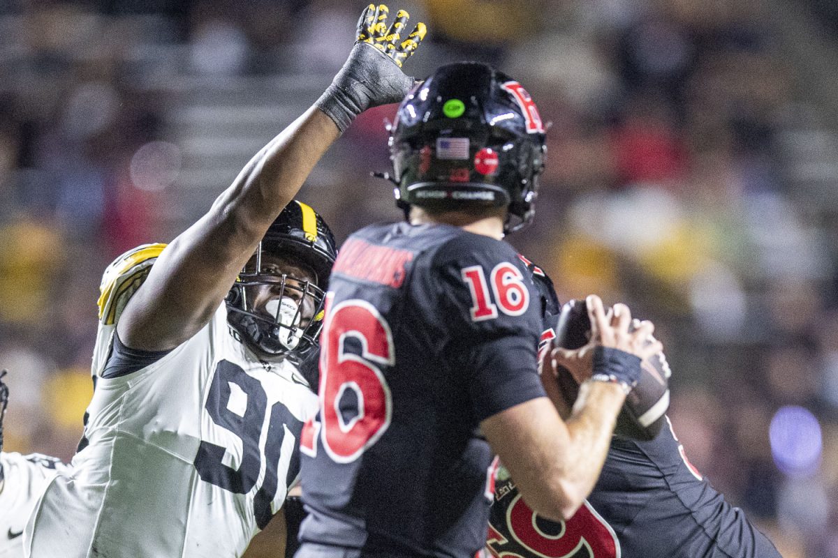 Iowa defensive end Brian Allen tries to break up Rutgers quarterback Athan Kaliakmanis’ pass during a football game between Iowa and Rutgers at SHI Stadium in Piscataway, N.J. on Sept. 19, 2025. The Hawkeyes defeated the Scarlet Knights 38-28.