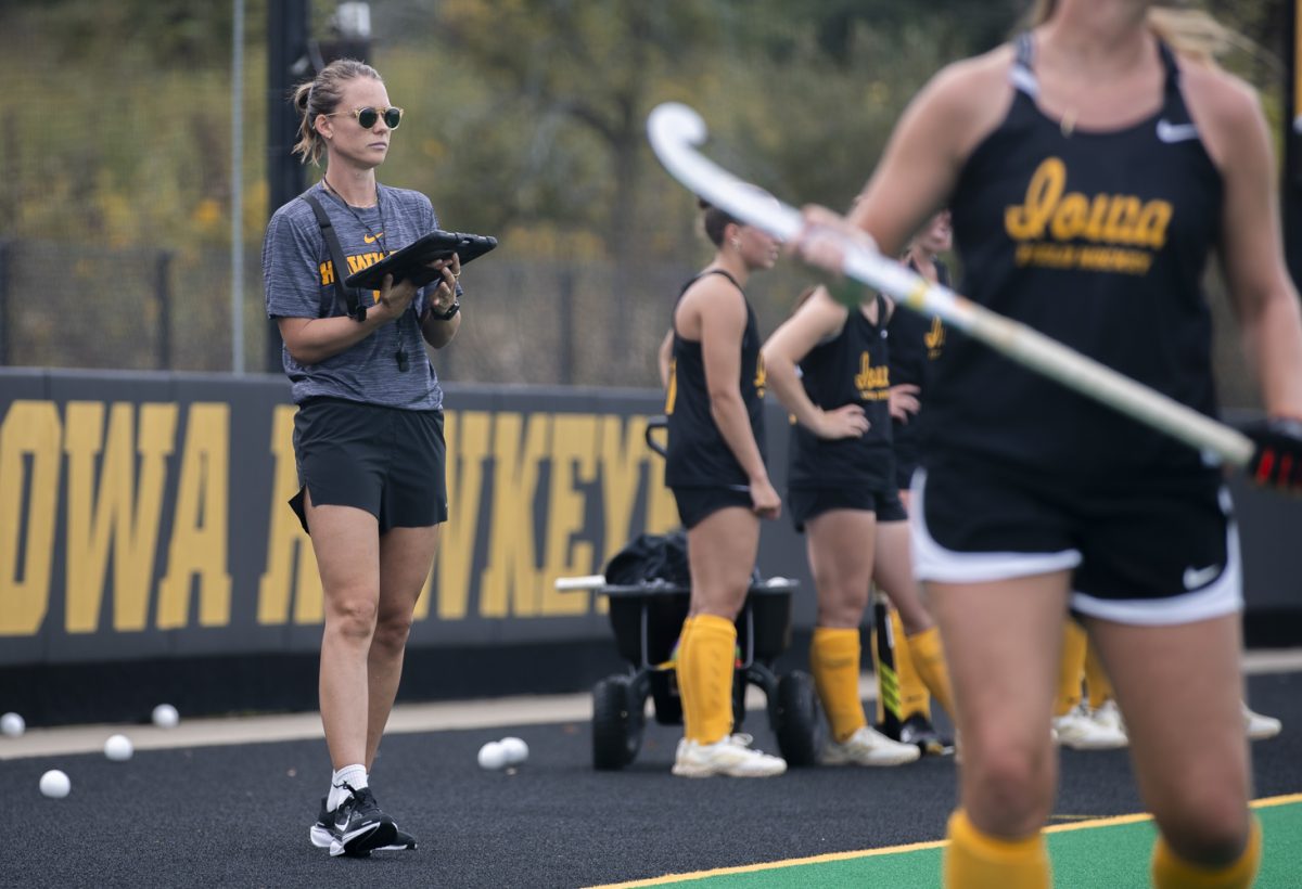 Iowa Field Hockey Assistant Coach, Jess Barnett, watches Iowa field hockey players complete drills during a practice at Grant Field, Iowa City, Iowa, on Tuesday, Sept. 23, 2025. Barnett was a former All-American for the Hawkeyes and is entering her fifth season as a member of the Iowa coaching staff.