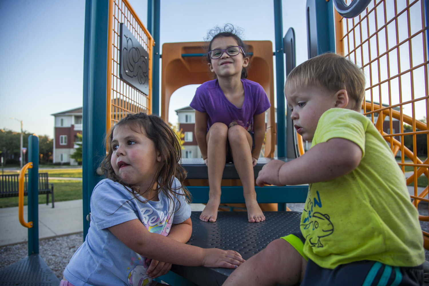 Rhiannon, 4, Freya, 7, and Archer McNulty, 1, play on the playground at Frauenholtz-Miller Park in Iowa City on Thursday, Sept. 25, 2025. Rhiannon has been hospitalized twice for respiratory syncytial virus (RSV), but has aged out of eligibility for the RSV vaccine. Archer is the only sibling out of the three to be young enough at the vaccine’s release to have received it.