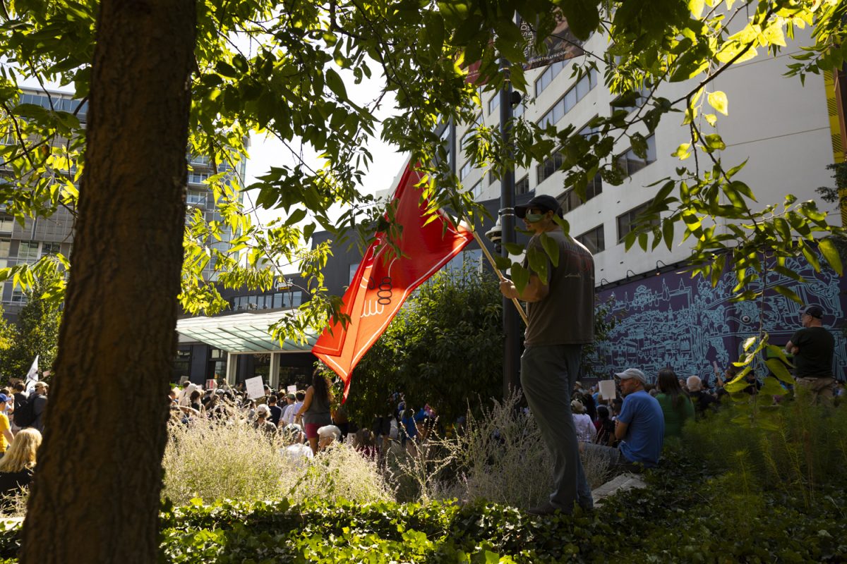 A community member holds up a flag during a rally at the Pedestrian Mall in Iowa City, Iowa on Friday, Sep. 26, 2025. Community members gathered in protest against ICE’s arrest of Jorge Elieser Gonzlez Ochoa while working at Bread Garden in Iowa City on Thursday, Sept. 25 at 11:00 a.m. Jorge’s family members, clergy, and elected leaders spoke at the rally.