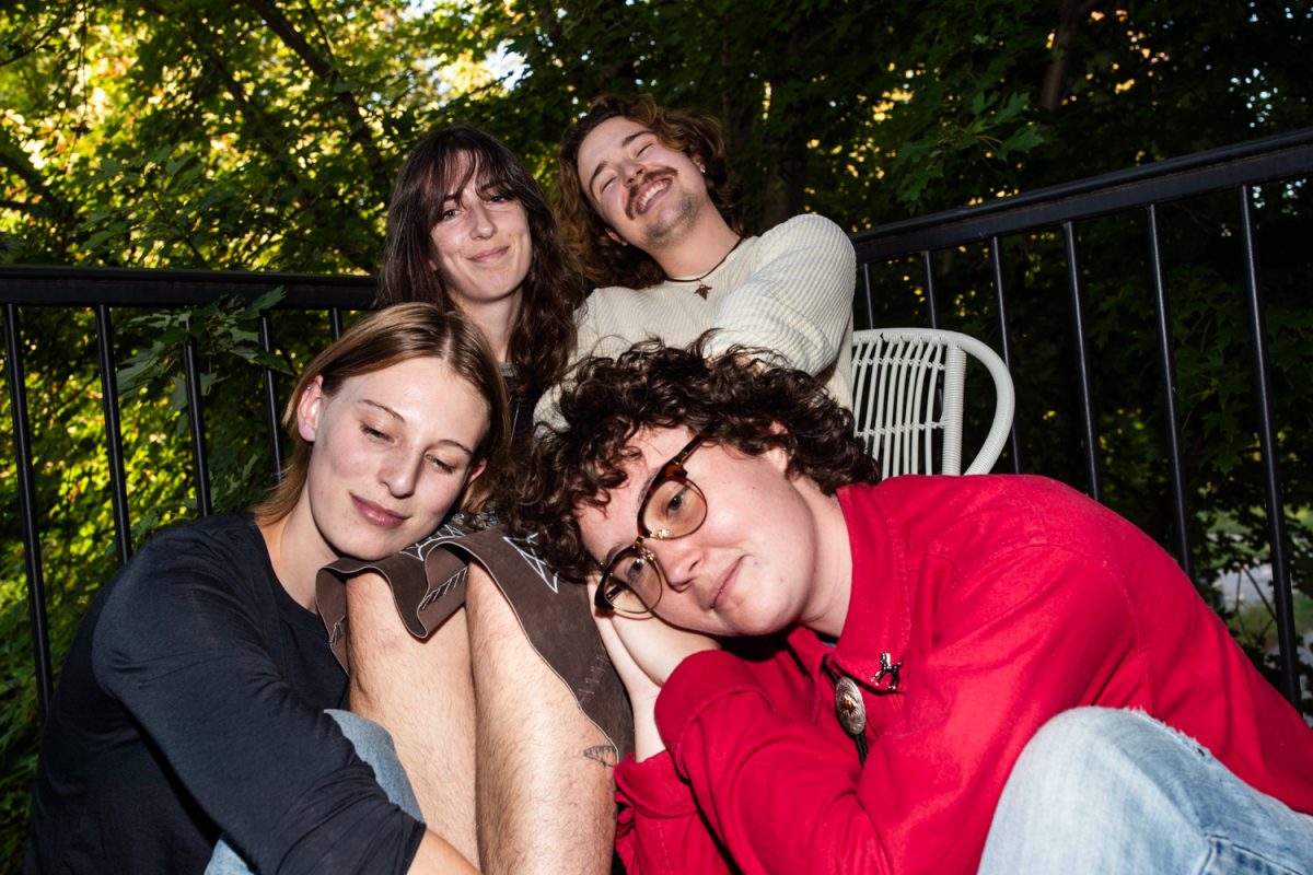 One More Hour band members Liv Caskey, Lindsey Carberry, Finnegan Angelos, and Iris Savage-Webster (left to right; Micah Miller not pictured) pose for a portrait at Angelos’s home in Iowa City on Saturday, Sept. 27, 2025. The band released their debut album “Lemons &amp; Garlic” on Sept. 13, which they recorded at the Voxman Music Building.
