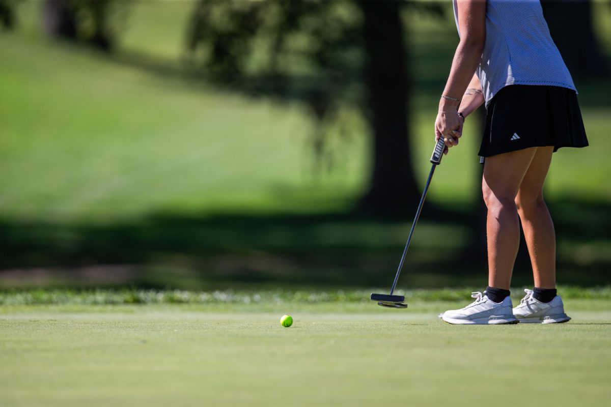 A golfer makes a putt on the green during the Diane Thomason Invitational at Finkbine Golf Course in Iowa City on Monday, Sept. 29, 2025. The Hawkeyes are trailing in third place behind South Dakota and Montana State, after the first round of three at the two-day tournament. Iowa’s Ximena Benites leads the team at two under par.