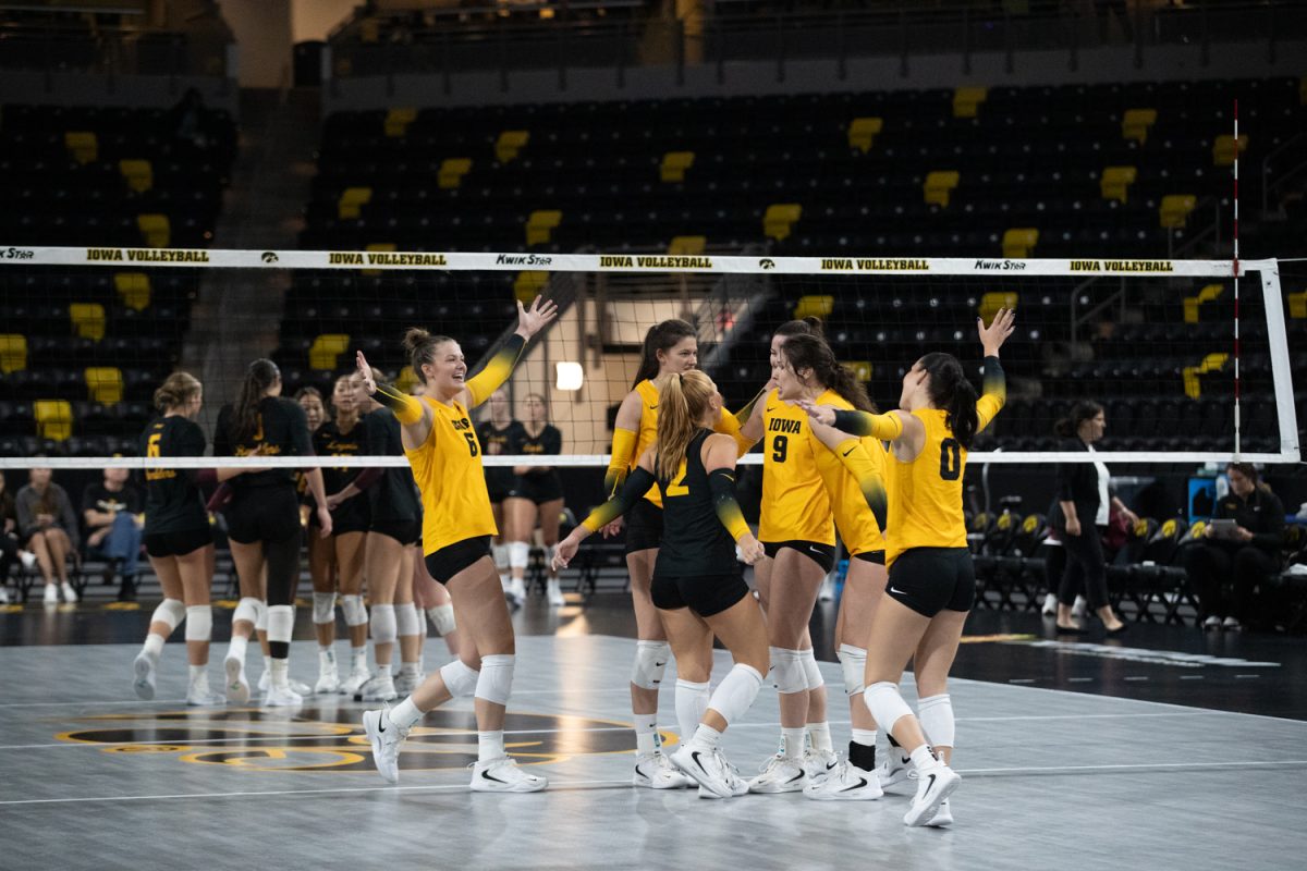 The Hawkeyes celebrate at the end of a volleyball game between Iowa and Loyola Chicago at Xtream Arena in Coralville on Saturday afternoon Sep. 6, 2025. The Hawkeyes defeated the Ramblers 3-0, improving their record to 6-0.
