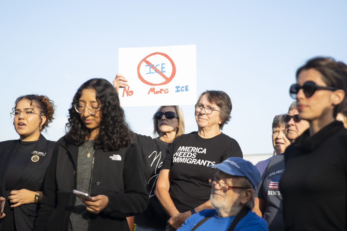 A protester holds up a sign during an anti-ICE protest organized by a Escucha Mi Voz at the Department of Homeland Security’s Ceder Rapids office on Wednesday, Oct. 1. This was to support families who came for their immigration check-ins and in protest of ICE officers.