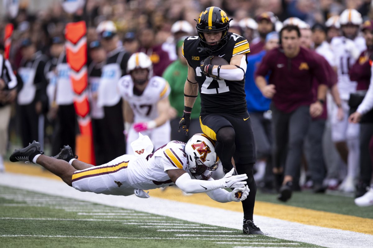 Minnesota defensive back Kerry Brown attempts to tackle Iowa wide receiver Kaden Wetjen during an Iowa football game against the University of Minnesota at Kinnick Stadium in Iowa City, Iowa on Oct. 25, 2025. Brown had five tackles. The Hawkeyes defeated the Golden Gophers 41-3.