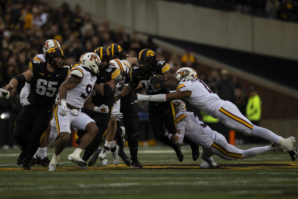 Iowa running back Kamari Moulton runs with the ball during an Iowa football game against the University of Minnesota at Kinnick Stadium in Iowa City, Iowa on Oct. 25, 2025. Moulton had 75 rushing yards. The Hawkeyes defeated the Golden Gophers 41-3.