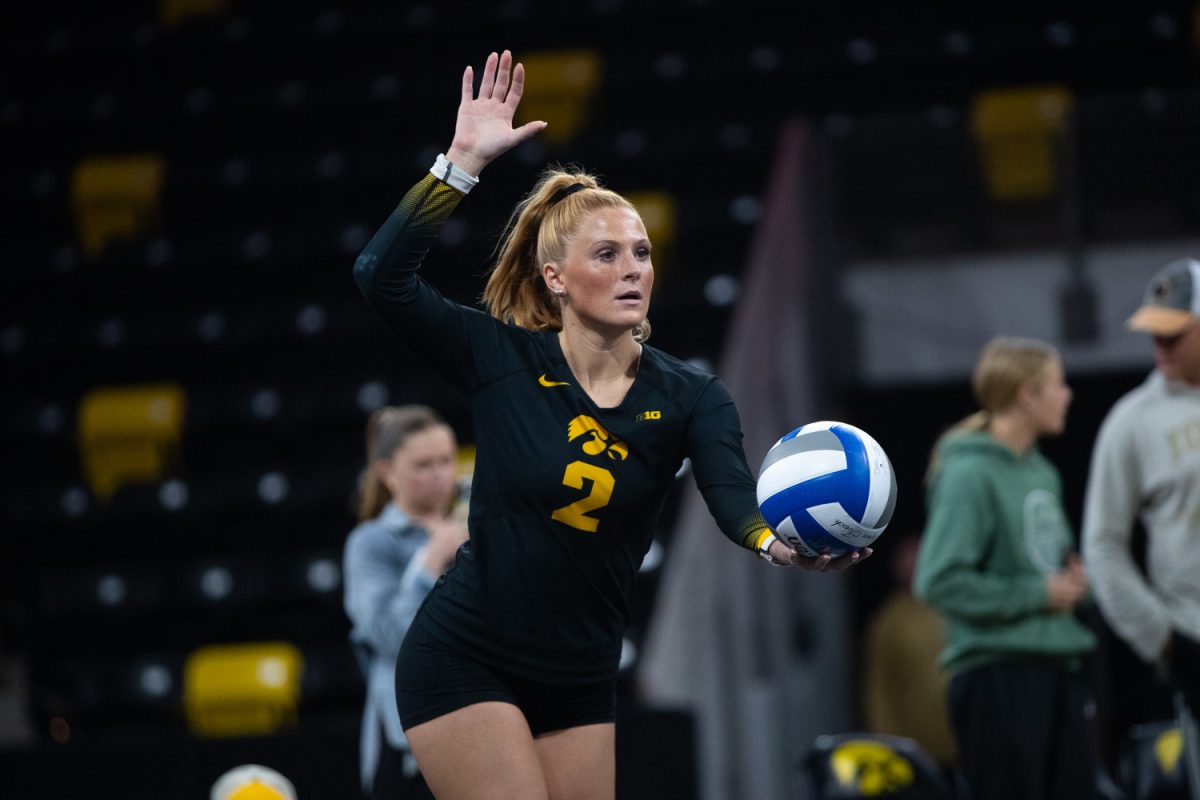 Iowa libero Milana Moisio prepares to serve in the volleyball game against Rutgers in Xtreme Arena in Coralville on Sunday, Oct. 26, 2025. The Hawkeyes defeat the Scarlet Knight 3-2 in a tense game.