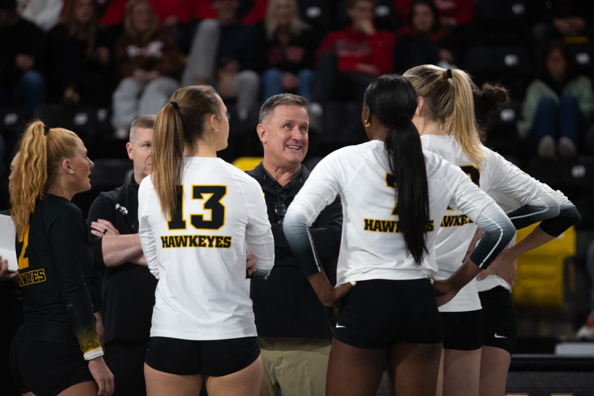 Iowa coach Jim Barnes speaks to the team in the volleyball game against Rutgers in Xtreme Arena in Coralville on Sunday, Oct. 26, 2025. The Hawkeyes defeat the Scarlet Knight 3-2 in a tense game.