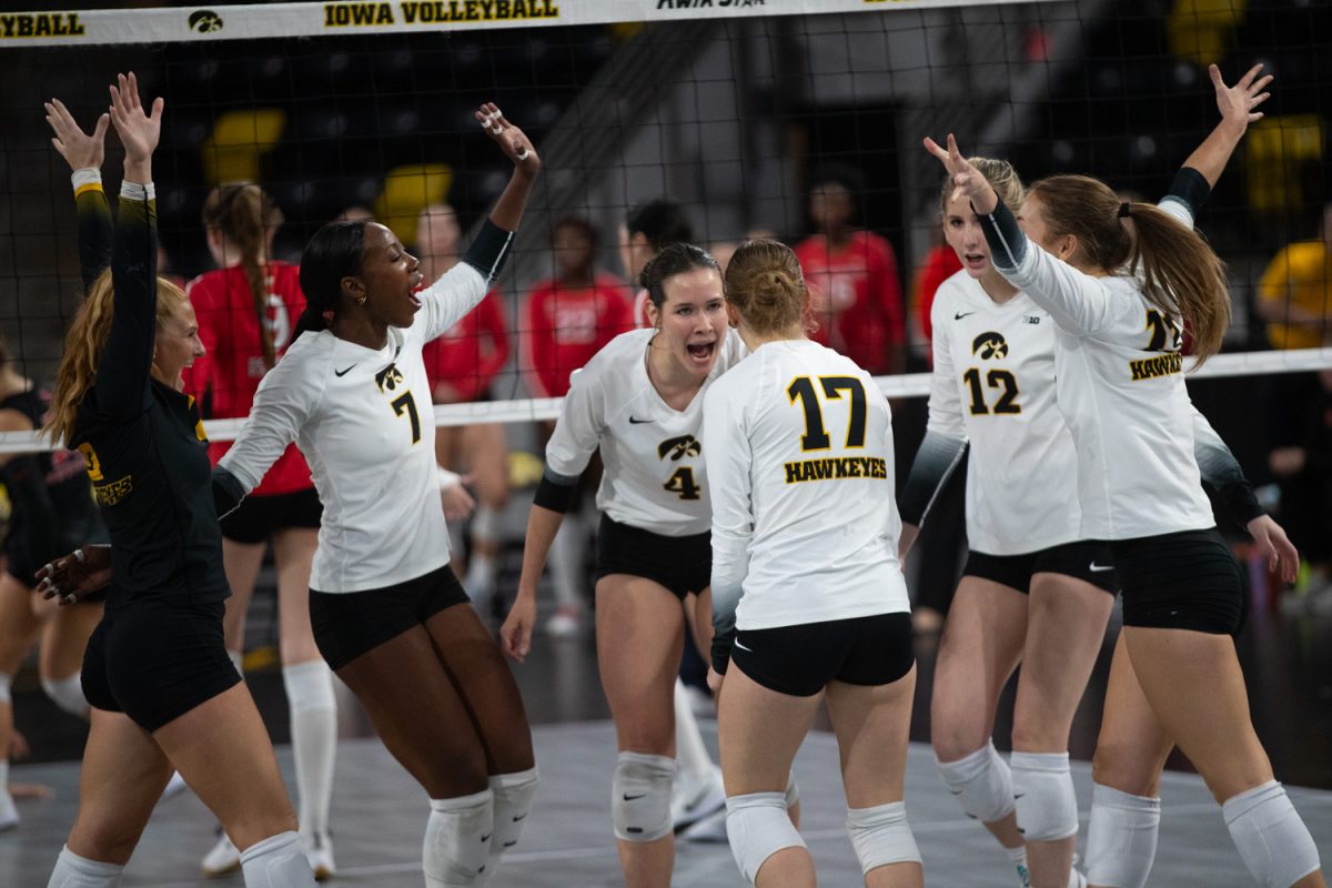 Iowa celebrates a setter dump from setter Claire Ammeraal in the volleyball game against Rutgers in Xtreme Arena in Coralville on Sunday, Oct. 26, 2025. The Hawkeyes defeat the Scarlet Knight 3-2 in a tense game.