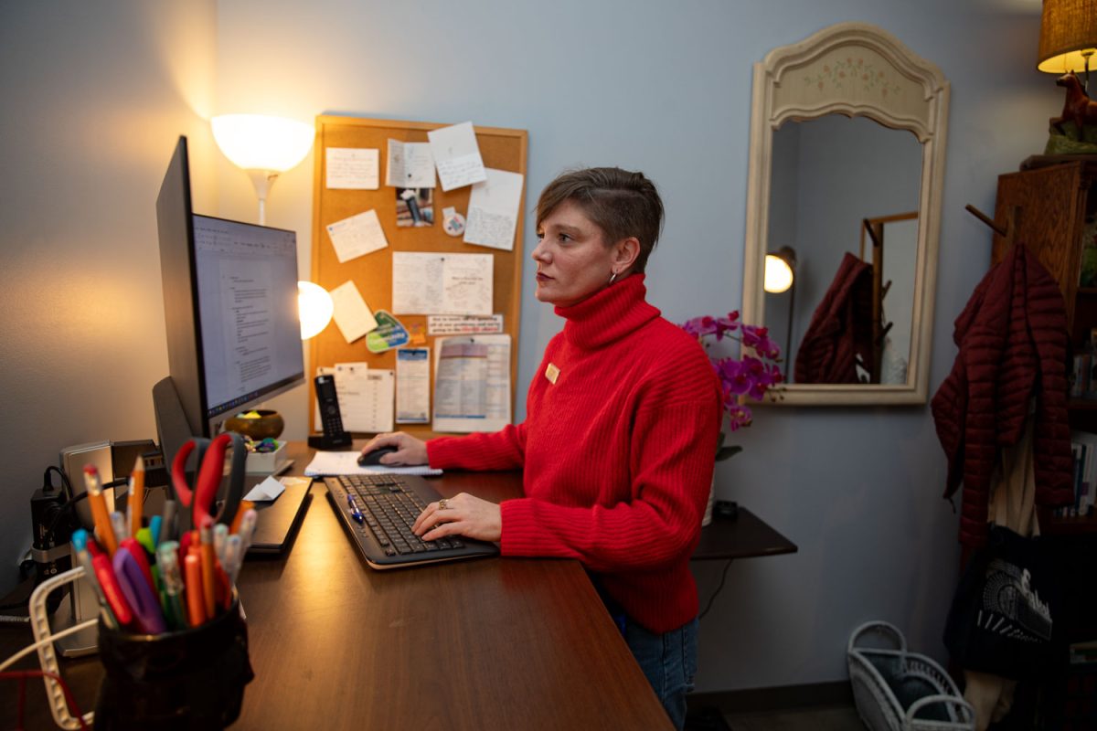 Amy Hospodarsky works at her office computer at Crowded Closet in Iowa City on Monday, Oct. 27, 2025. Hospodarsky is running from Iowa City Council this upcoming election, and has worked as director at the Crowded Closet for the past year because “It’s a mesh of all the causes I’m interested in.”