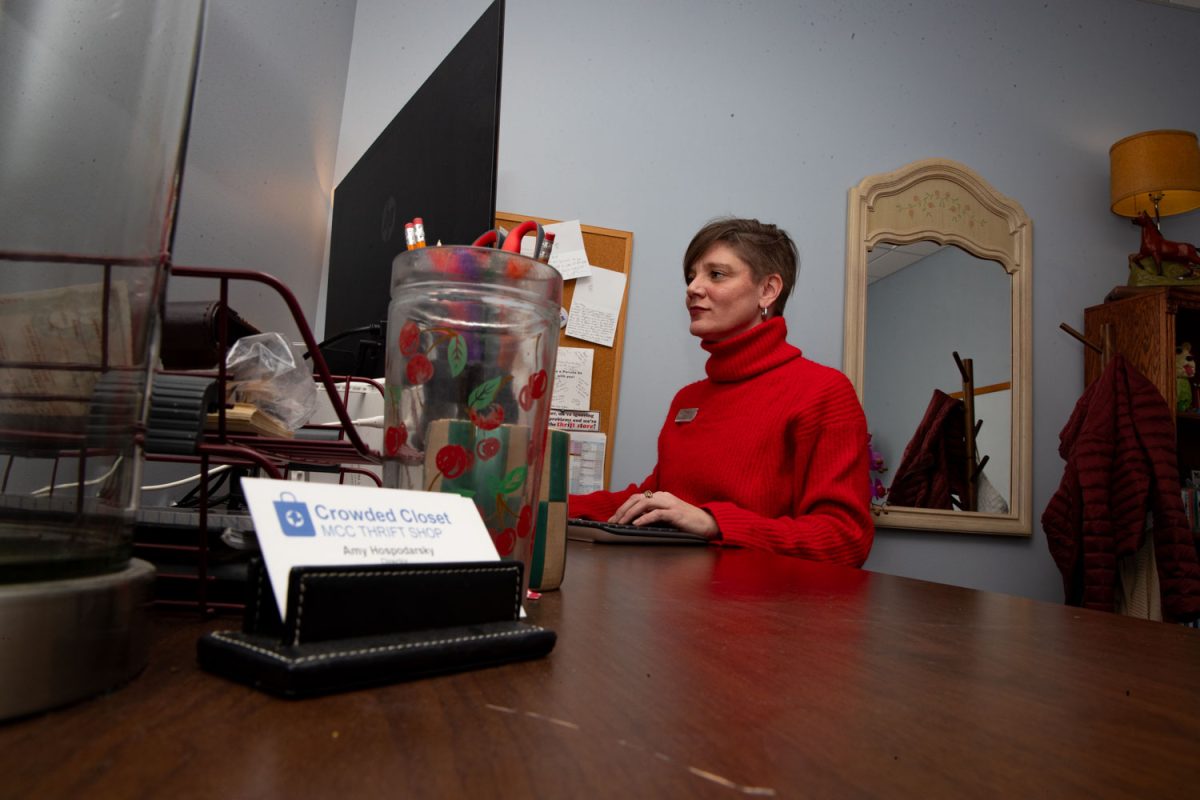 Amy Hospodarsky works at her office computer at Crowded Closet in Iowa City on Monday, Oct. 27, 2025. Hospodarsky is running from Iowa City Council this upcoming election, and has worked as director at the Crowded Closet for the past year because “It’s a mesh of all the causes I’m interested in.”