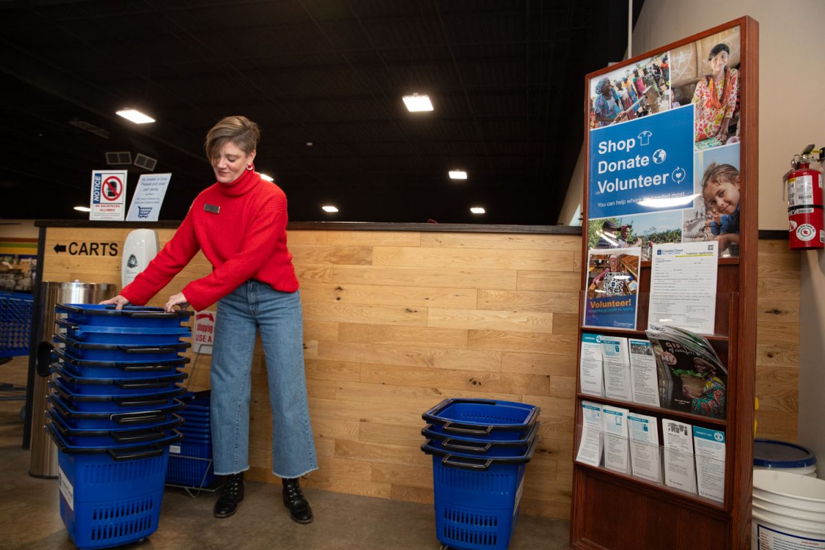 Amy Hospodarsky organizes bins at Crowded Closet in Iowa City on Monday, Oct. 27, 2025. Hospodarsky is running from Iowa City Council this upcoming election, and has worked as director at the Crowded Closet for the past year because “It’s a mesh of all the causes I’m interested in.”