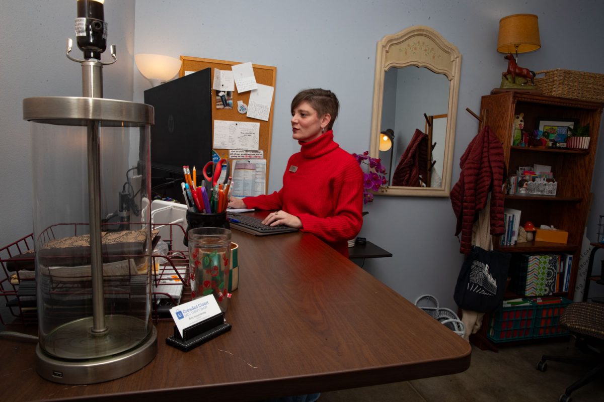 Amy Hospodarsky works at her office computer at Crowded Closet in Iowa City on Monday, Oct. 27, 2025. Hospodarsky is running from Iowa City Council this upcoming election, and has worked as director at the Crowded Closet for the past year because “It’s a mesh of all the causes I’m interested in.”
