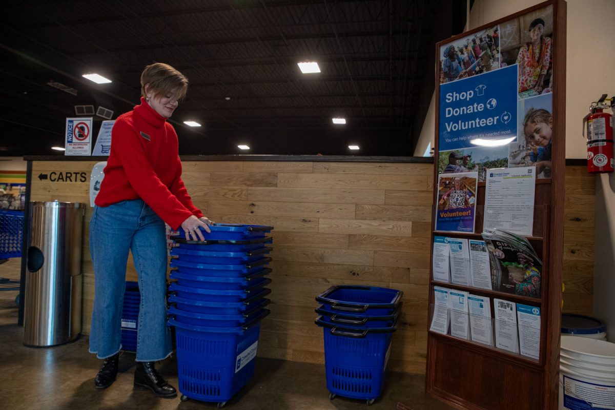 Amy Hospodarsky organizes bins at Crowded Closet in Iowa City on Monday, Oct. 27, 2025. Hospodarsky is running from Iowa City Council this upcoming election, and has worked as director at the Crowded Closet for the past year because “It’s a mesh of all the causes I’m interested in.”