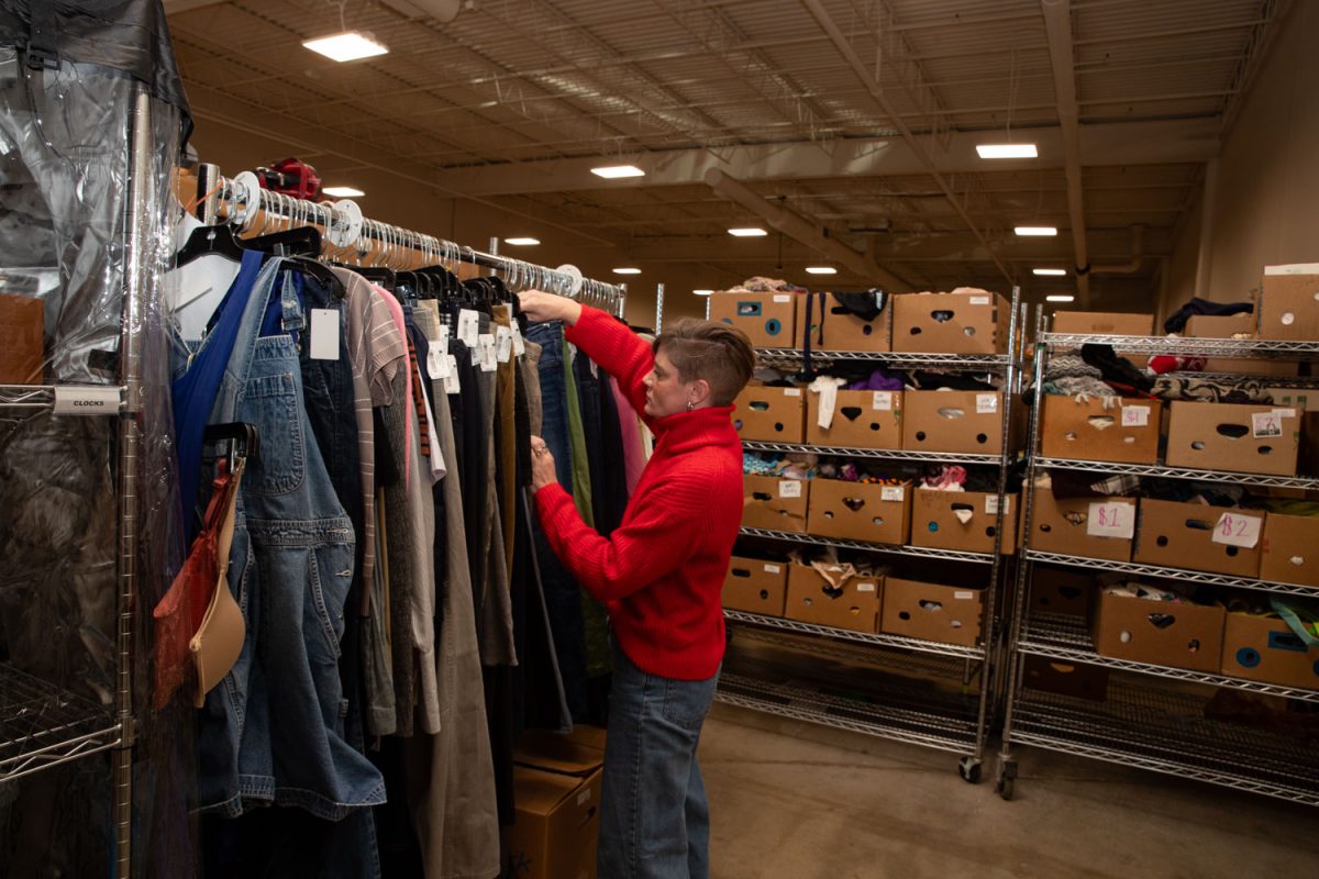 Amy Hospodarsky works in the racks at Crowded Closet in Iowa City on Monday, Oct. 27, 2025. Hospodarsky is running from Iowa City Council this upcoming election, and has worked as director at the Crowded Closet for the past year because “It’s a mesh of all the causes I’m interested in.”