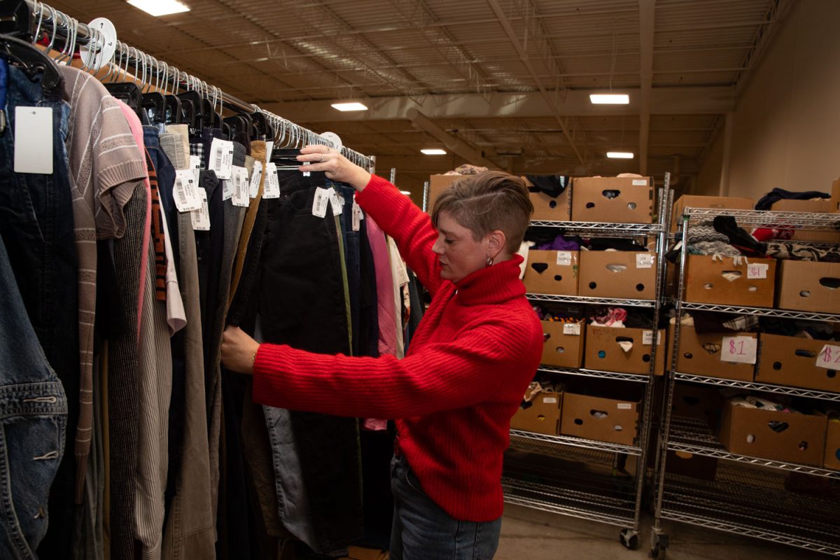 Amy Hospodarsky works in the racks at Crowded Closet in Iowa City on Monday, Oct. 27, 2025. Hospodarsky is running from Iowa City Council this upcoming election, and has worked as director at the Crowded Closet for the past year because “It’s a mesh of all the causes I’m interested in.”