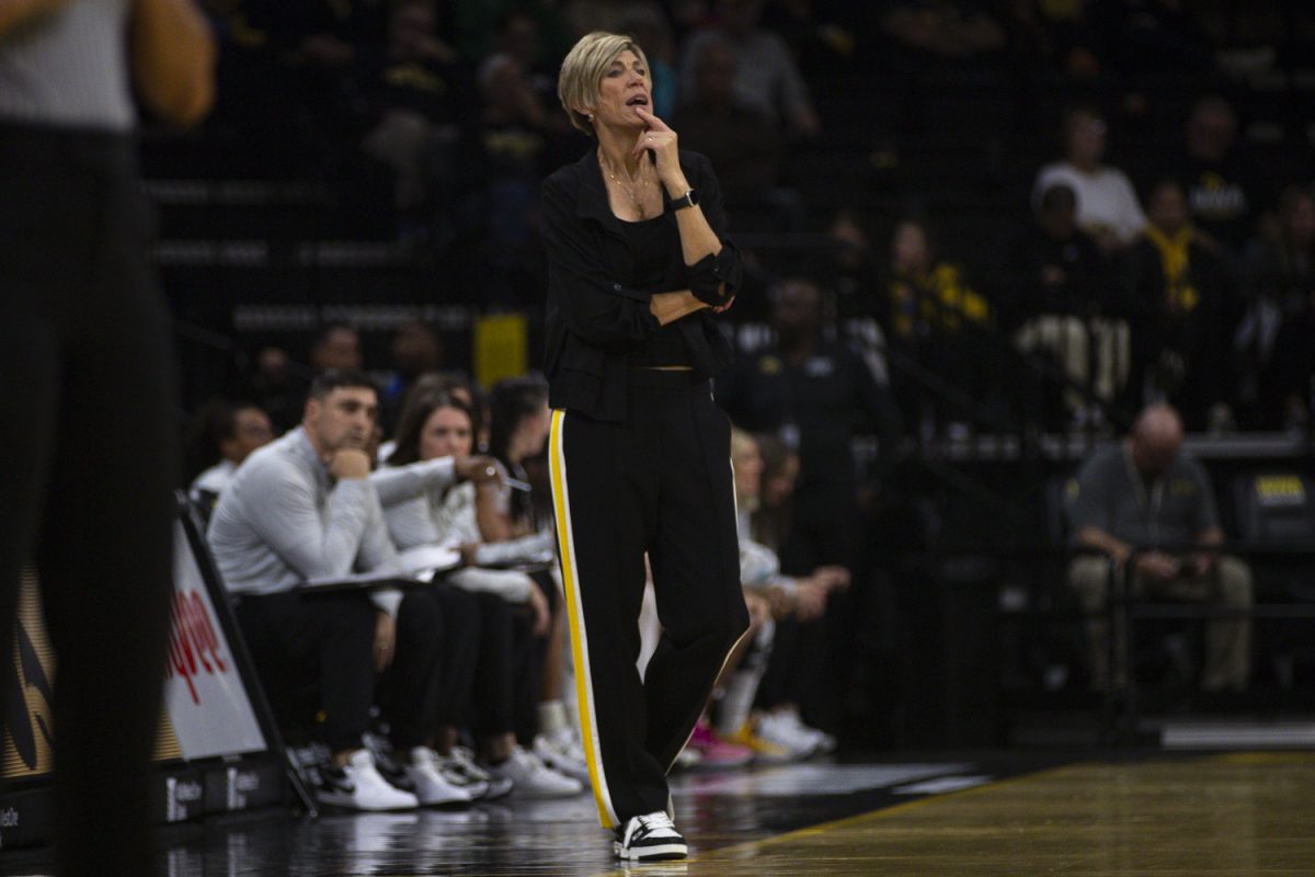 Iowa head coach Jan Jensen watches the game during an Iowa women's basketball exhibition game against Ashland University on Thursday, Oct. 30, 2025 at Carver-Hawkeye Arena in Iowa City, Iowa. This is Jensen’s second year as head coach. The Hawkeyes defeated the Eagles 104-63.