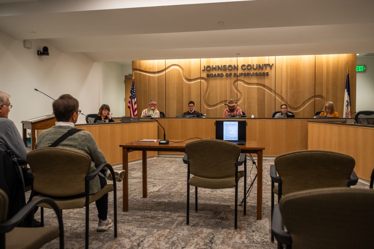 Chairperson Jon Green reads the agenda during a formal meeting of the Johnson County Board of Supervisors inside the County Health and Human Services Building in Iowa City on Thursday, Nov. 6, 2025.