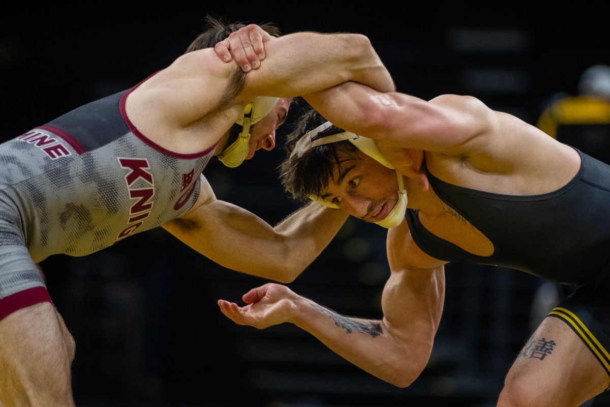 125 pounder, No. 10 Dean Petersen watches for potential offensive attack against opponent Damion Ryan during a wrestling dual between the No. 3 Iowa Hawkeyes and the Bellarmine Knights at Carver Hawkeye Arena in Iowa City, Iowa on Thursday, Nov. 6, 2025. Petersen defeated Ryan 5-0. Petersen is a transfer from the Rutgers as was a three time NCAA Championship Qualifier. The Hawkeyes defeated the Knights 40-0.