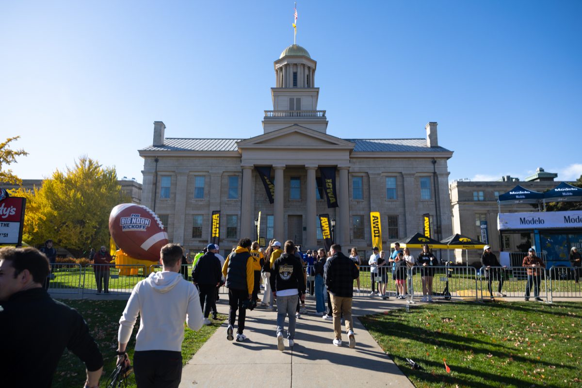 Big Noon Kickoff Media Availability attendees shelter in place after an active shooter Hawk Alert on Friday, Nov. 7, 2025 in Iowa City, Iowa.