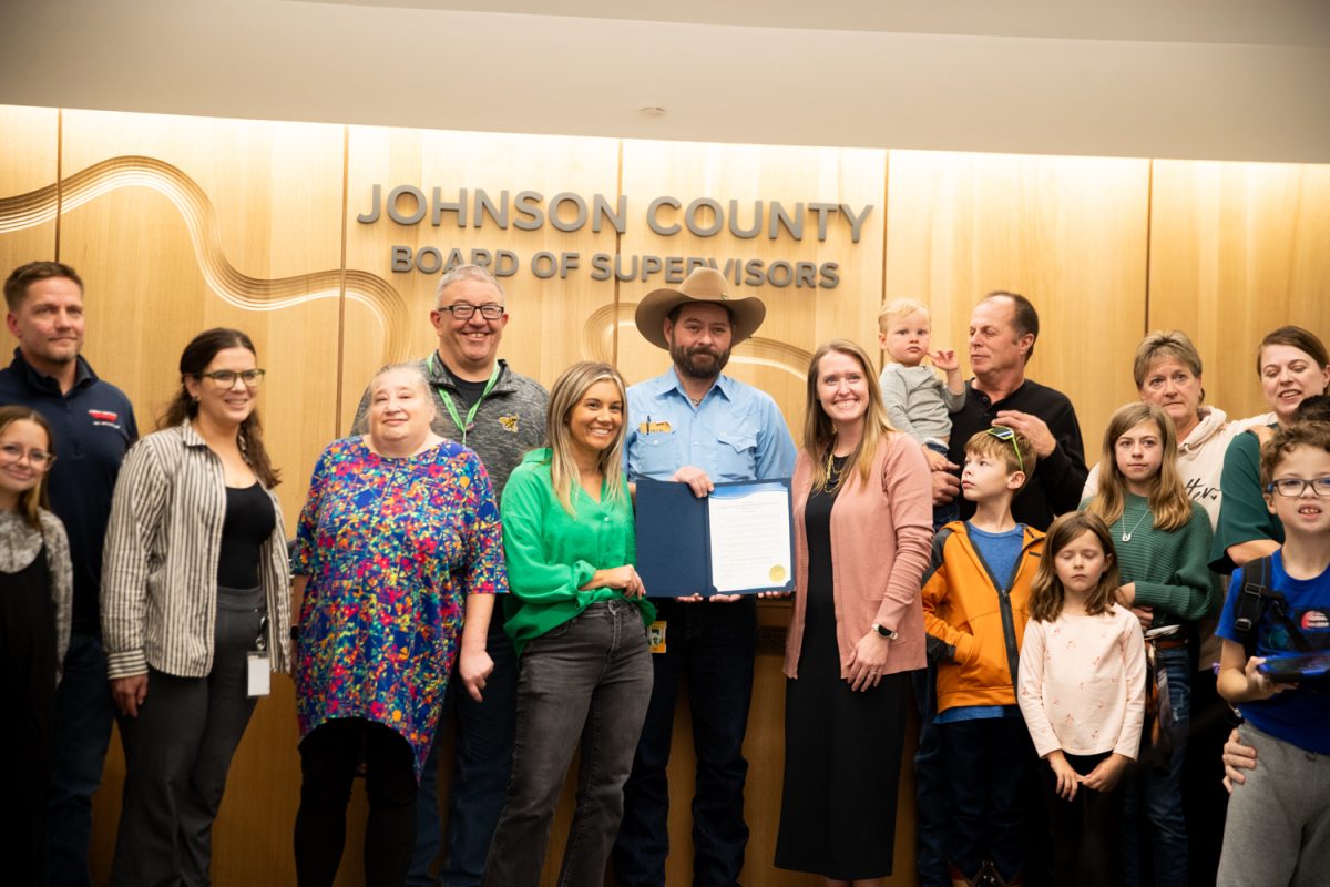Four Oaks family gets their picture taken during a Johnson County Board of Supervisors formal session on Thursday, Nov. 13, 2025 in Iowa City.