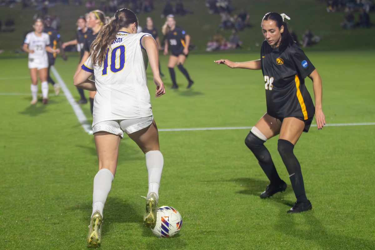 Mia Bosch dribbles the ball as Kenzie Roling defends doing her best not letting Mia get by in the NCAA D1 Women’s Soccer First Round on Friday, Nov. 14, 2025. Iowa beats South Dakota State 1-0 to move on to round two of the NCAA tournament.