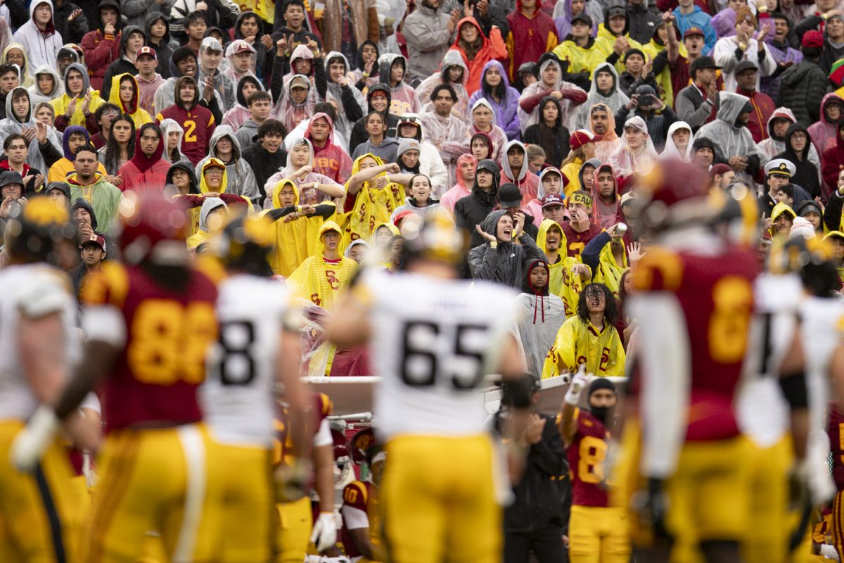Fans signal a false start during a football game between the Iowa Hawkeyes and the USC Trojans at Los Angeles Memorial Coliseum in Los Angeles, Calif., on Saturday, Nov. 15, 2025. The Trojans defeated the Hawkeyes 26-21.
