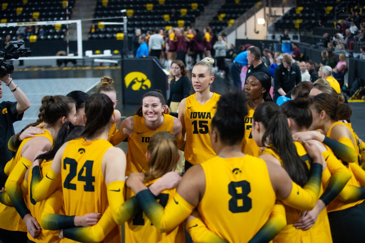 Iowa huddles up before the game at the Iowa vs. No. 20 Minnesota volleyball game in Coralville at the Xtreme Arena on Sunday, Nov. 16, 2025. The Hawkeyes almost pull off the upset but lose lose 2-3 to the Gophers.