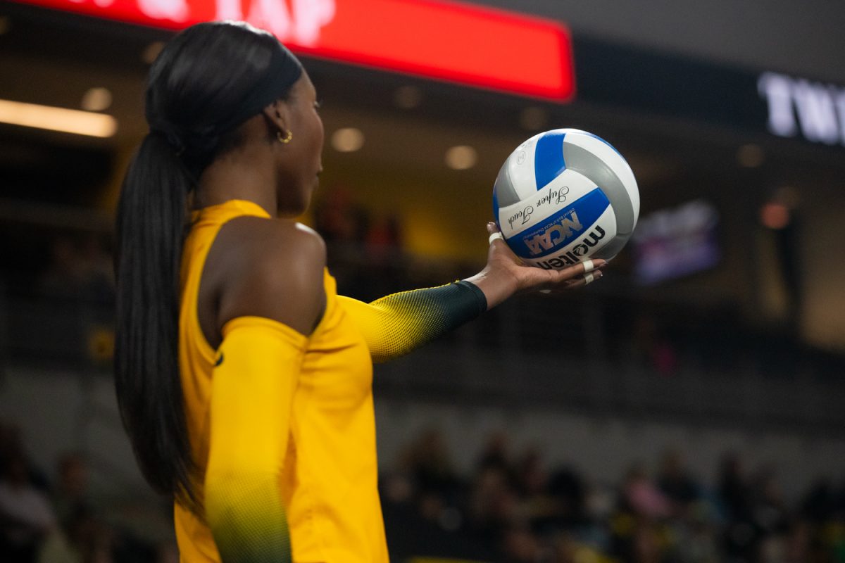 Iowa graduate outside hitter Chard’e Vanzandt prepares to serve the ball at the Iowa vs. No. 20 Minnesota volleyball game in Coralville at the Xtreme Arena on Sunday, Nov. 16, 2025. Vanzandt served 18 times and came away with two service aces. The Hawkeyes almost pull off the upset but lose lose 2-3 to the Gophers.