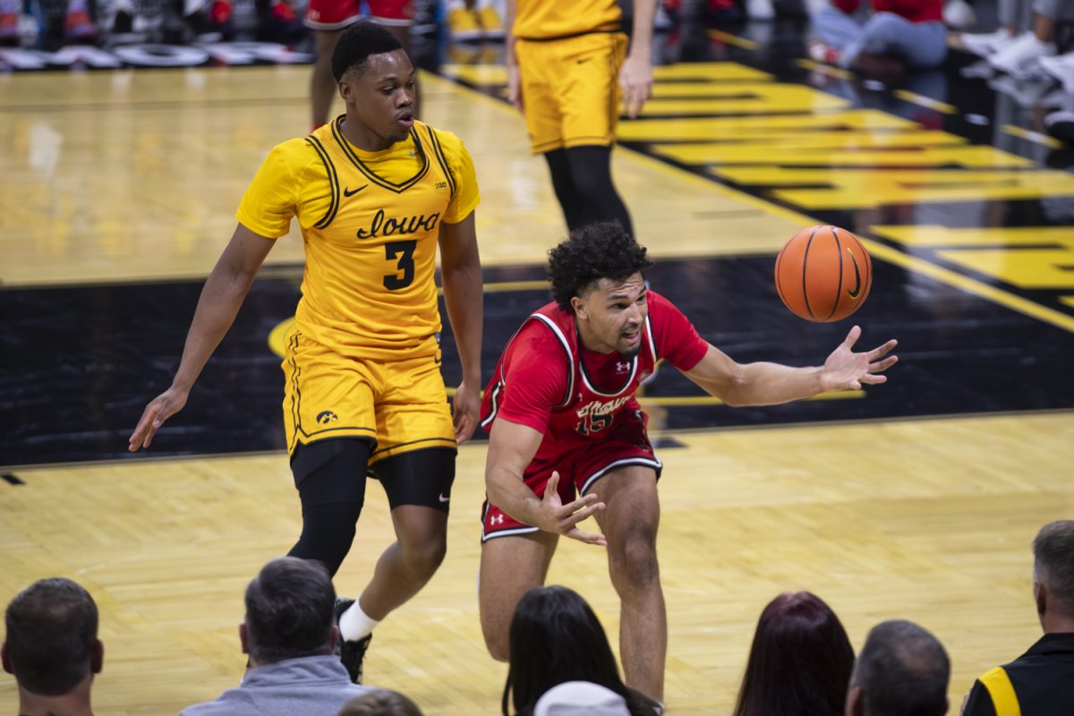 Southeast Missouri forward Brendan Terry attempts to get the ball before it goes out of bounds during a basketball game between the Iowa Hawkeyes and the Southeast Missouri State Redhawks at Carver-Hawkeye Arena on Thursday, Nov. 18, 2025. The Hawkeyes defeated the Redhawks 99-70.