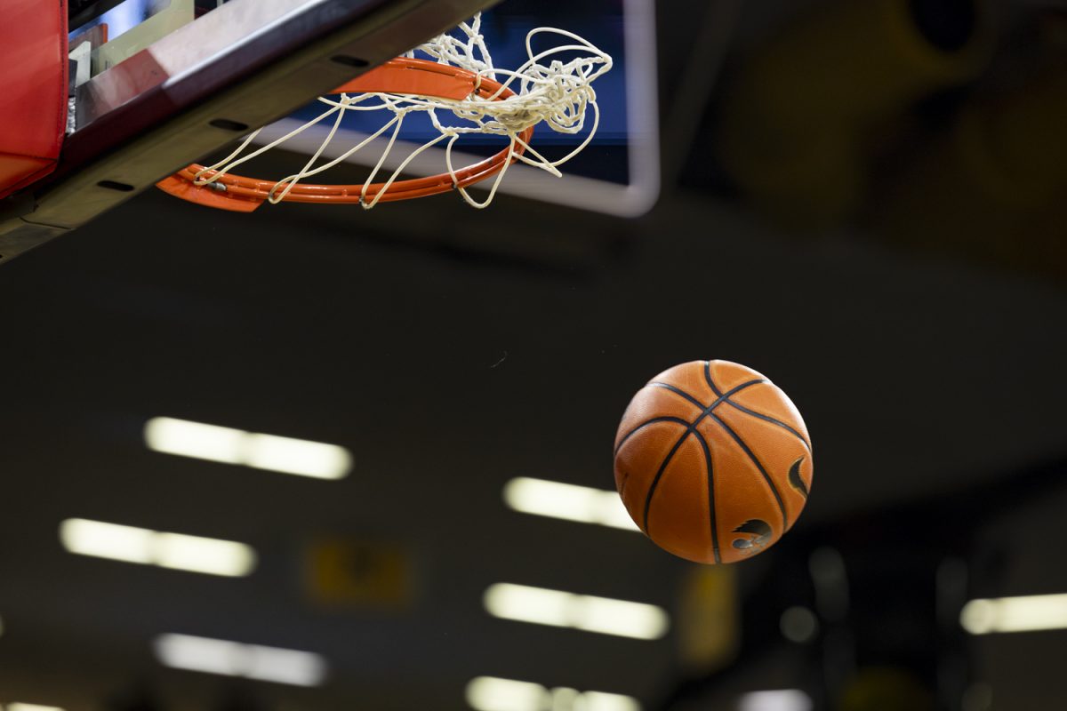 A ball falls through the net during a basketball game between the Iowa Hawkeyes and the Southeast Missouri State Redhawks at Carver-Hawkeye Arena on Thursday, Nov. 18, 2025. The Hawkeyes defeated the Redhawks 99-70.