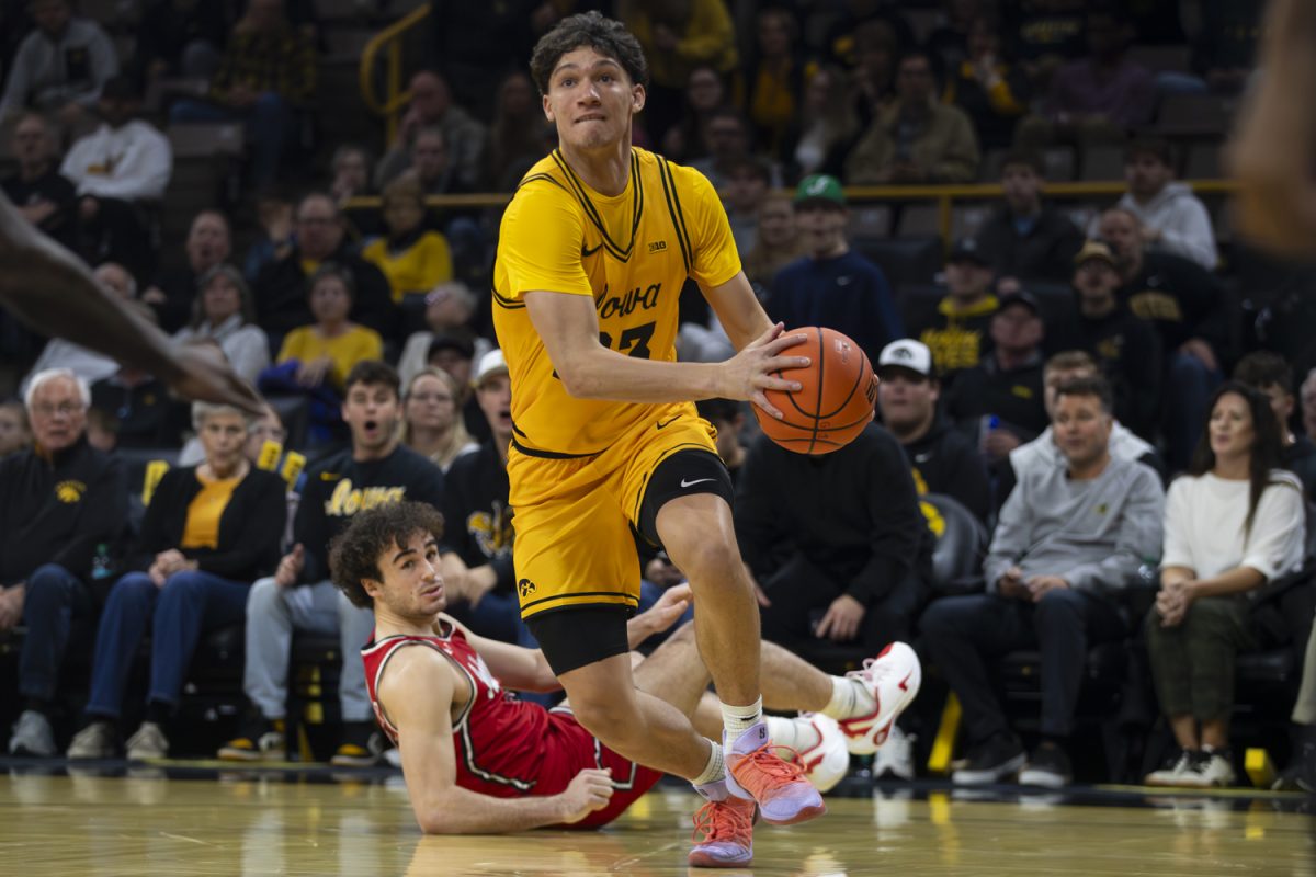 Iowa guard Isaia Howard gets the ball past Southeast Missouri guard Teddy Washington Jr. during a basketball game between the Iowa Hawkeyes and the Southeast Missouri State Redhawks at Carver-Hawkeye Arena on Thursday, Nov. 18, 2025. The Hawkeyes defeated the Redhawks 99-70.