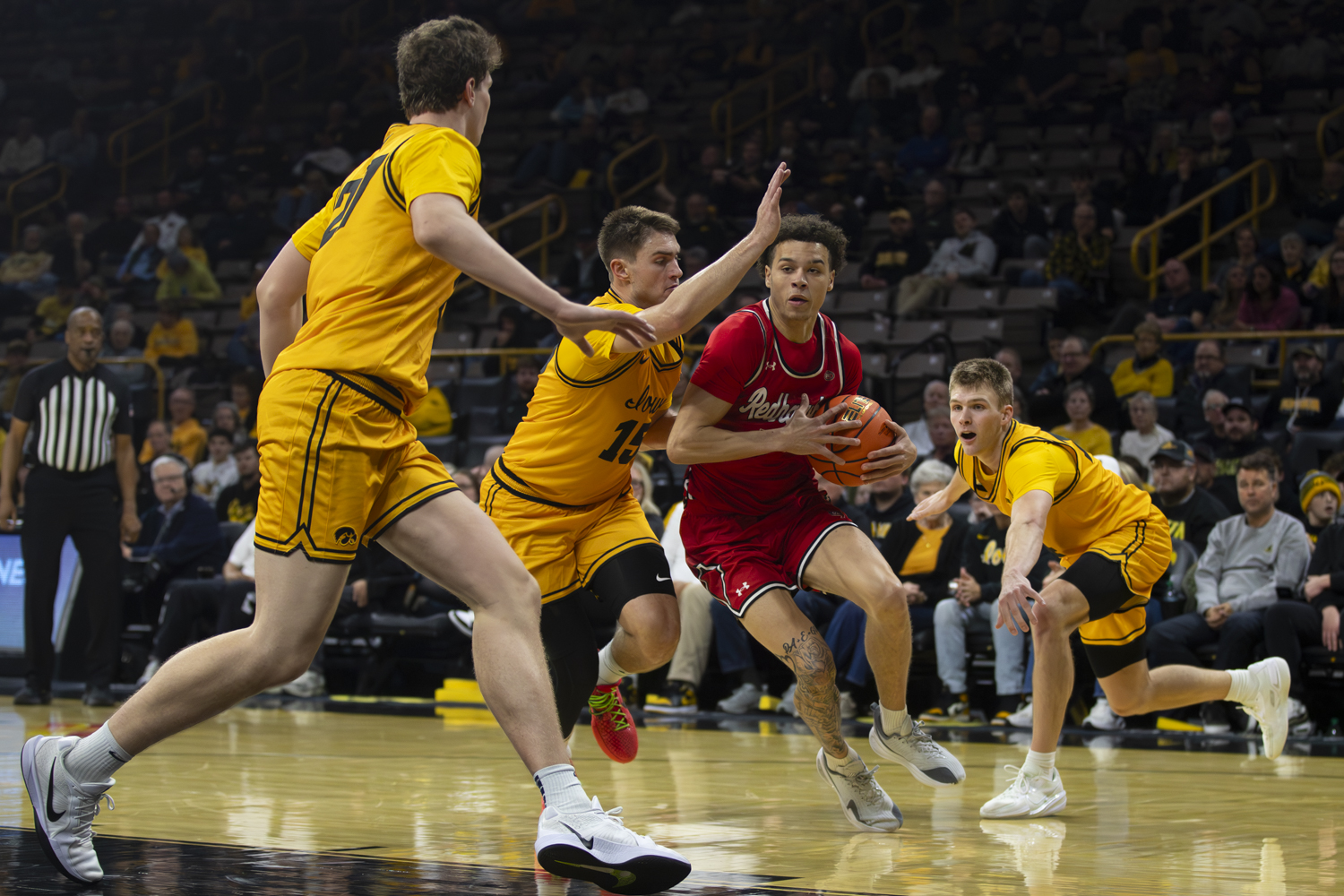 Southeast Missouri guard Marqueas Bell attempts to get past the Iowa defense during a basketball game between the Iowa Hawkeyes and the Southeast Missouri State Redhawks at Carver-Hawkeye Arena on Thursday, Nov. 18, 2025. Bell added seven points. The Hawkeyes defeated the Redhawks 99-70.