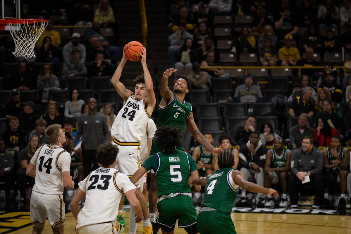 Freshman guard Tate Sage rips down a rebound during a basketball game between the Iowa Hawkeyes and the Chicago State Cougars at Carver-Hawkeye Arena on Thursday, Nov. 20, 2025. The Hawkeyes defeated the Cougars 93-54. Sage tallied 13 points on the night.