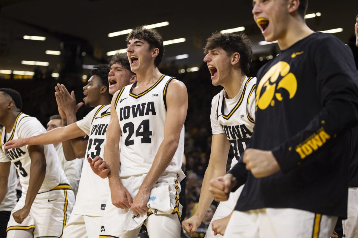 The Iowa bench celebrates during a basketball game between the Iowa Hawkeyes and the Chicago State Cougars at Carver-Hawkeye Arena on Thursday, Nov. 20, 2025. The Hawkeyes defeated the Cougars 93-54.