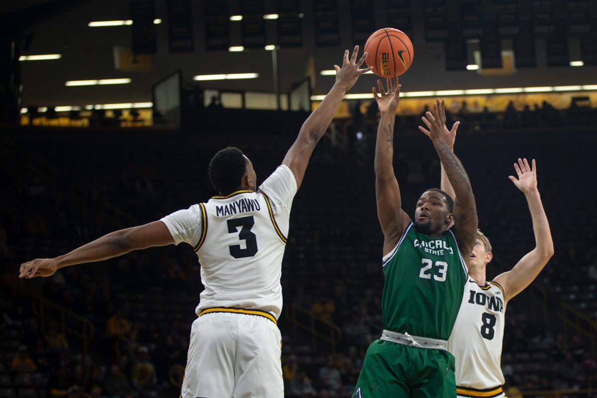 Junior Forward Cam Manyawu goes up for a block during a basketball game between the Iowa Hawkeyes and the Chicago State Cougars at Carver-Hawkeye Arena on Thursday, Nov. 20, 2025. The Hawkeyes defeated the Cougars 93-54. Manyawu played at Drake University last season before transferring to Iowa where he has started  the last five games.