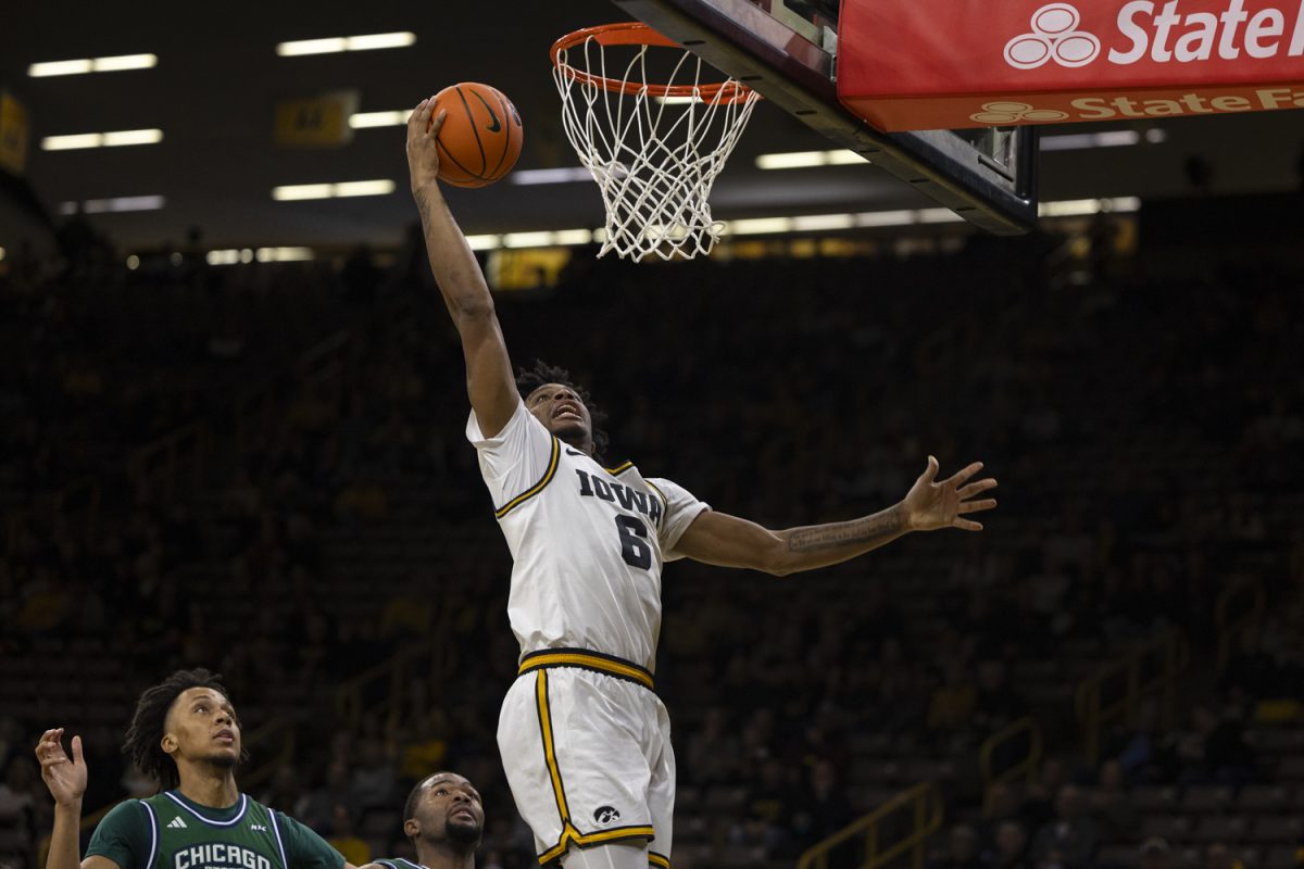 Freshman guard Tate Sage rips down a rebound during a basketball game between the Iowa Hawkeyes and the Chicago State Cougars at Carver-Hawkeye Arena on Thursday, Nov. 20, 2025. The Hawkeyes defeated the Cougars 93-54. Sage tallied 13 points on the night.