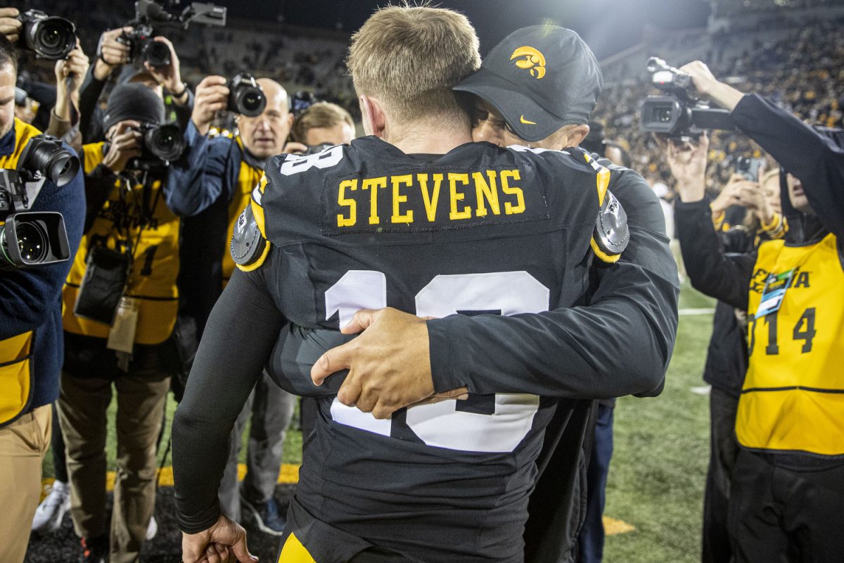 Special teams coordinator Levar Woods and Iowa kicker Drew Stevens embrace following a football game between Michigan State and Iowa at Kinnick Stadium on Nov. 22, 2025. Stevens made two of his three field goal attempts. The Hawkeyes defeated the Spartans 20-17.