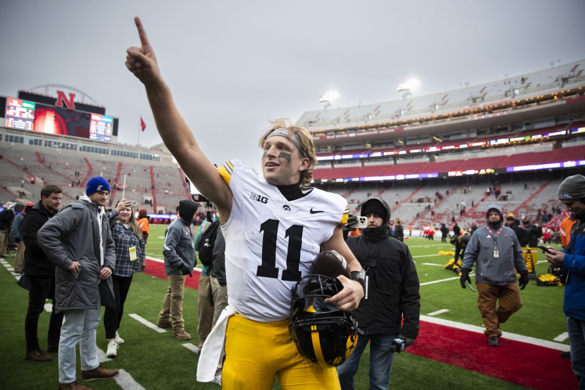 Iowa quarterback Mark Gronowski points towards Iowa fans after a football game between Iowa and Nebraska at Memorial Stadium in Lincoln, Nebraska on Friday, Nov. 28, 2025. The Hawkeyes defeated the Cornhuskers 40-16.