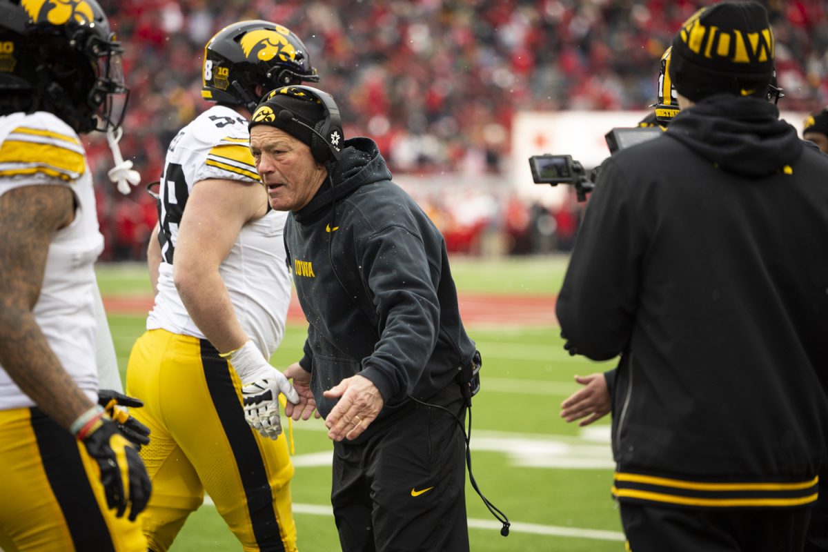 Iowa head coach Kirk Ferentz high-fives players during a football game between Iowa and Nebraska at Memorial Stadium in Lincoln, Nebraska on Friday, Nov. 28, 2025. The Hawkeyes defeated the Cornhuskers 40-16.
