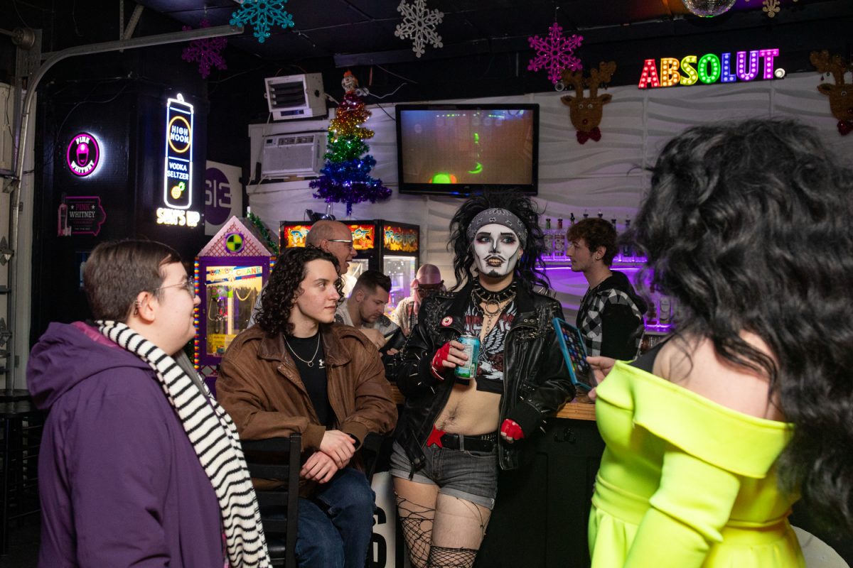 Cecil Campbell speaks to friends in drag at Studio 13 on Thursday, Dec. 4, 2025. “Once I’m on stage, I lose all my stage fright.” (Ava Neumaier/The Daily Iowan)