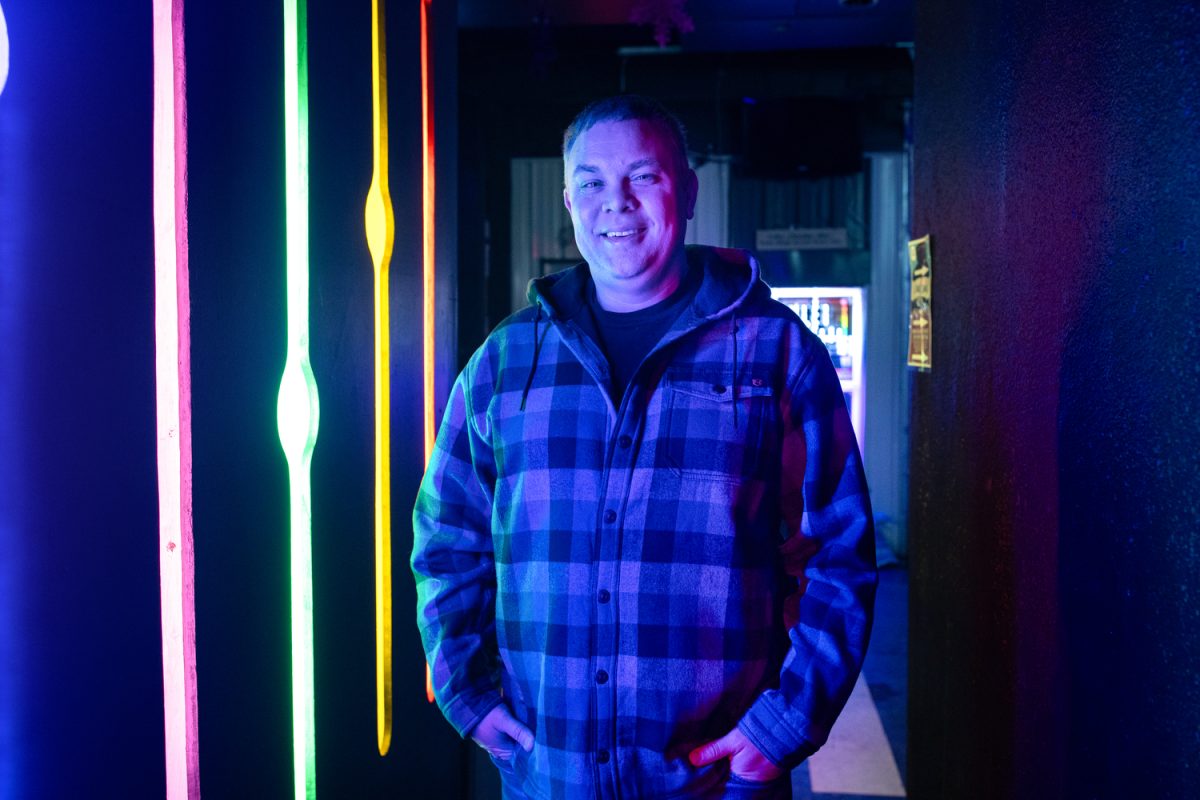 Jason Zeman poses for a photo at Studio 13 on Friday, Dec. 5, 2025. “There’s really nothing else like it in Iowa City.” (Ava Neumaier/The Daily Iowan)