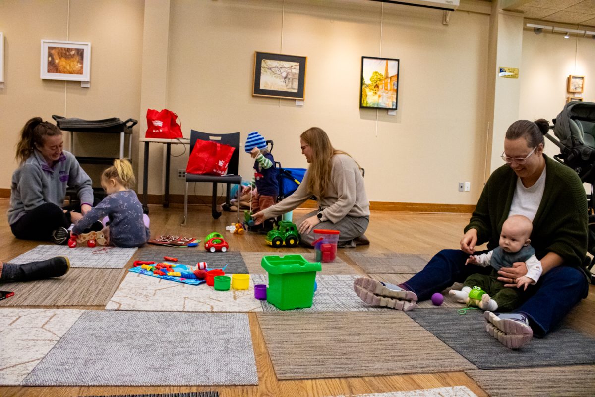 Angie Pilkington leads a children’s play hour at the Senior Center in Iowa City on Wednesday, Nov. 19, 2025. The next event is on December 14, and is frequently attended by regular families with their babies.
