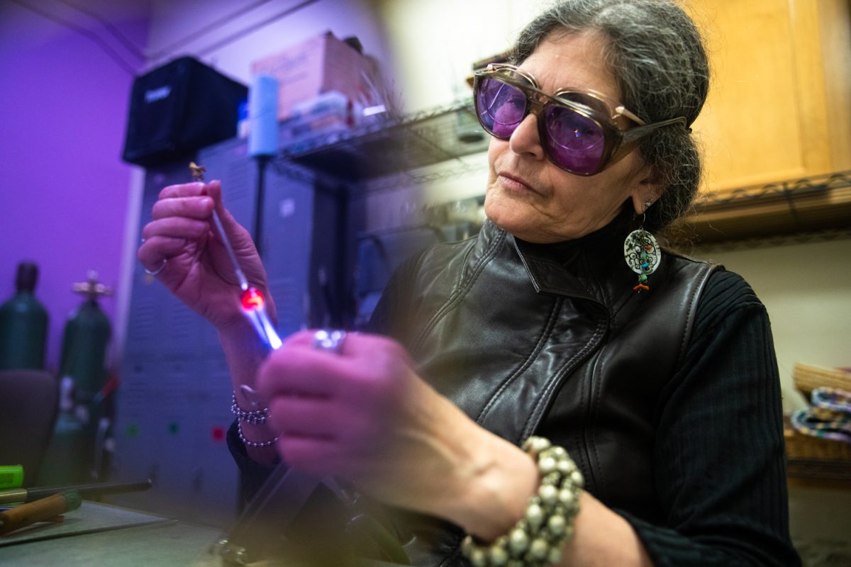 Karen Kubby operates the blow torch at Beadology in Iowa City on Thursday, Nov. 20, 2025. Kubby, a former Iowa City councilor, now owns Beadology and works with the Downtown District.