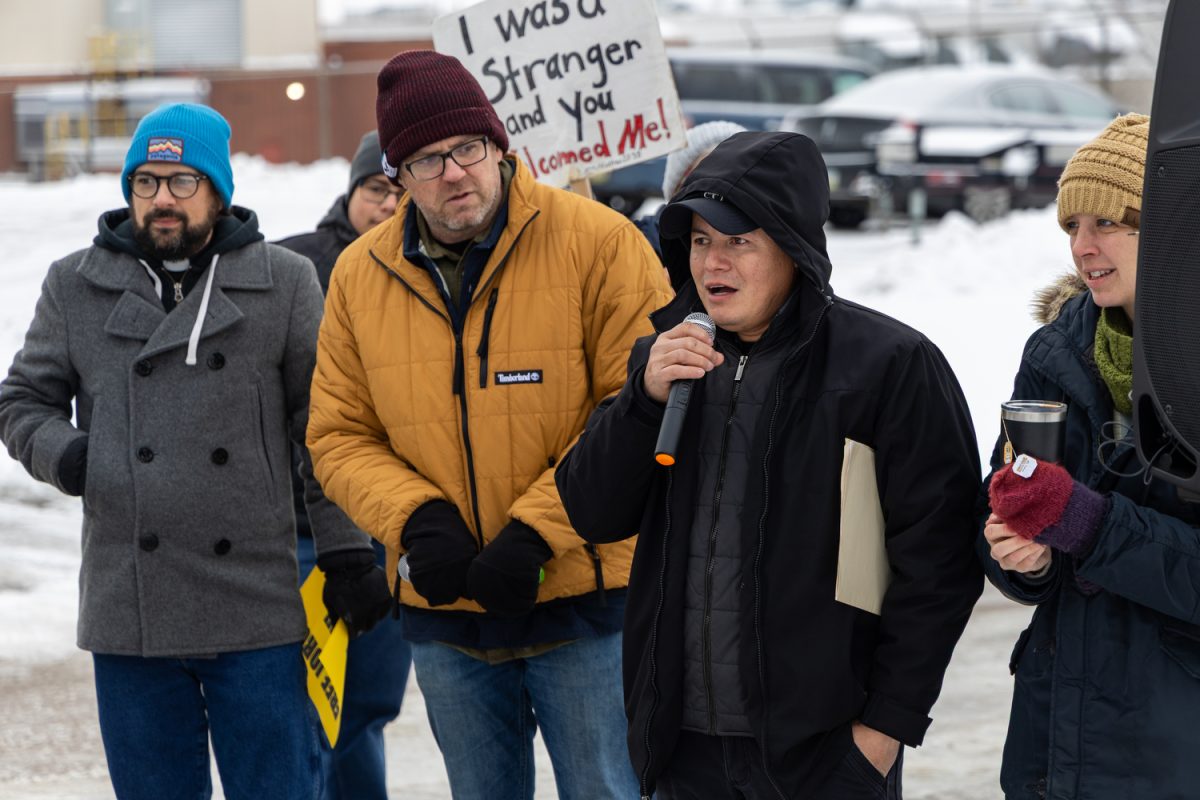 Jaime Bentacourth speaks in Spanish during a protest on the sidewalk outside the U.S. Department of Homeland Security Investigation Office on Tuesday, Dec. 2, 2025. The protest accompanied 56 migrants without permanent legal residency to their annual check-in with Immigration and Customs Enforcement agents, all 56 exited without being detained.