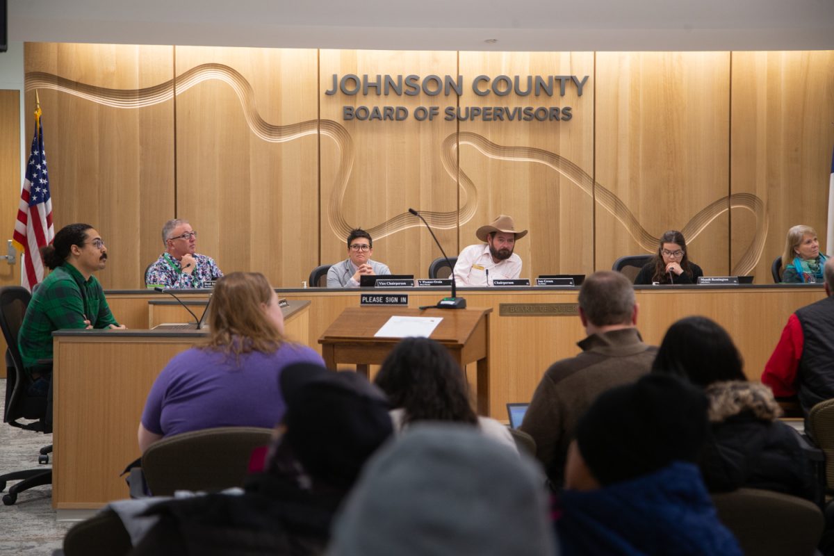 Board members are seen listening to speakers during a formal meeting of the Johnson County Board of Supervisors inside the County Health and Human Services Building in Iowa City on Wednesday, Dec. 10, 2025.