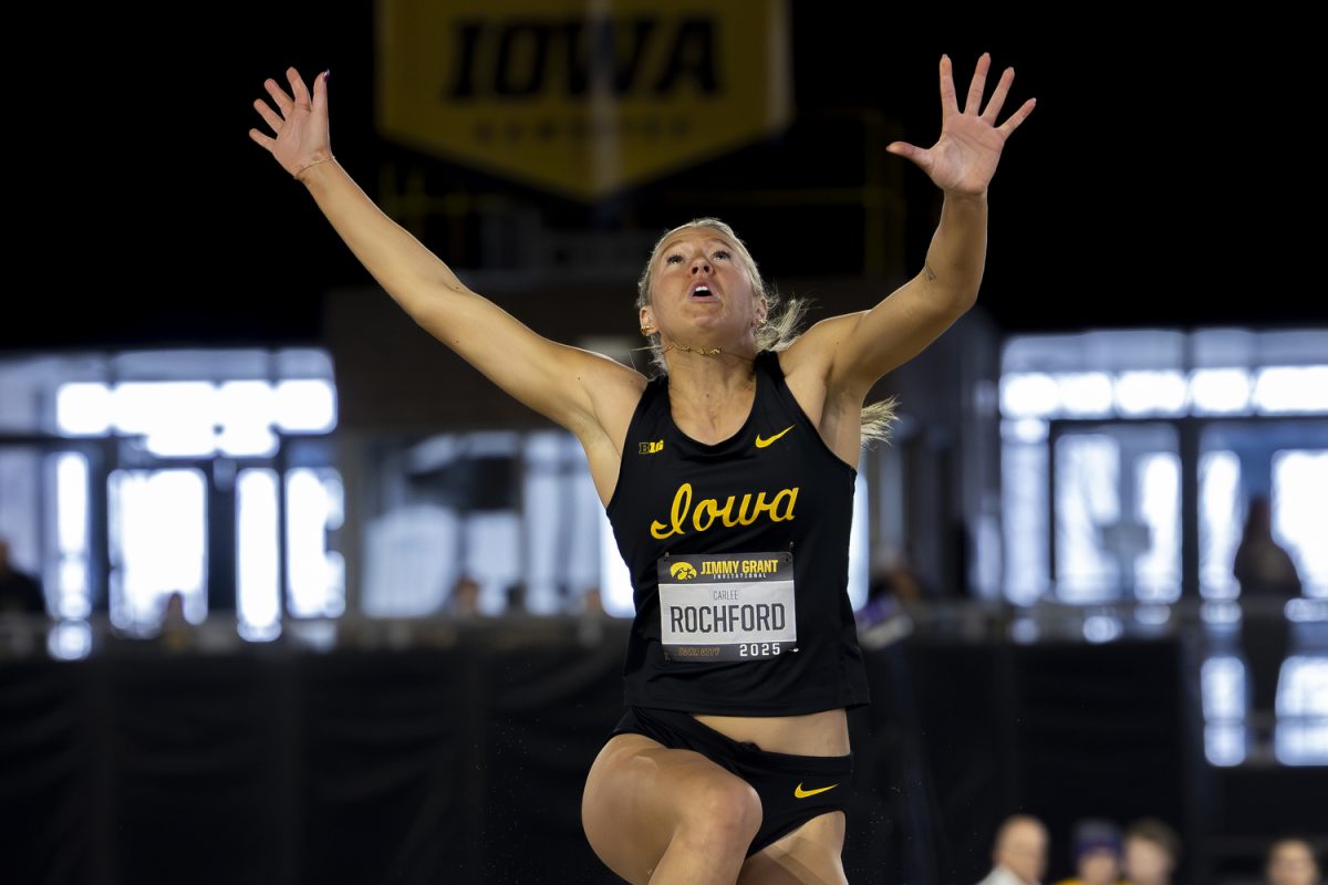 Iowa Long Jumper, Carlee Rochford, flies through the air during the track and field Jimmy Grant Invitational at the Hawkeye Indoor Track Facility in Iowa City, Iowa on Saturday, Dec. 13, 2025. Rochford recorded a 1.64 high jump for the Hawkeyes. The Hawkeyes hosted the universities of Central Iowa, Grinnell, Judson, Northern Iowa, South Central Iowa, Western Illinois, and William Penn.