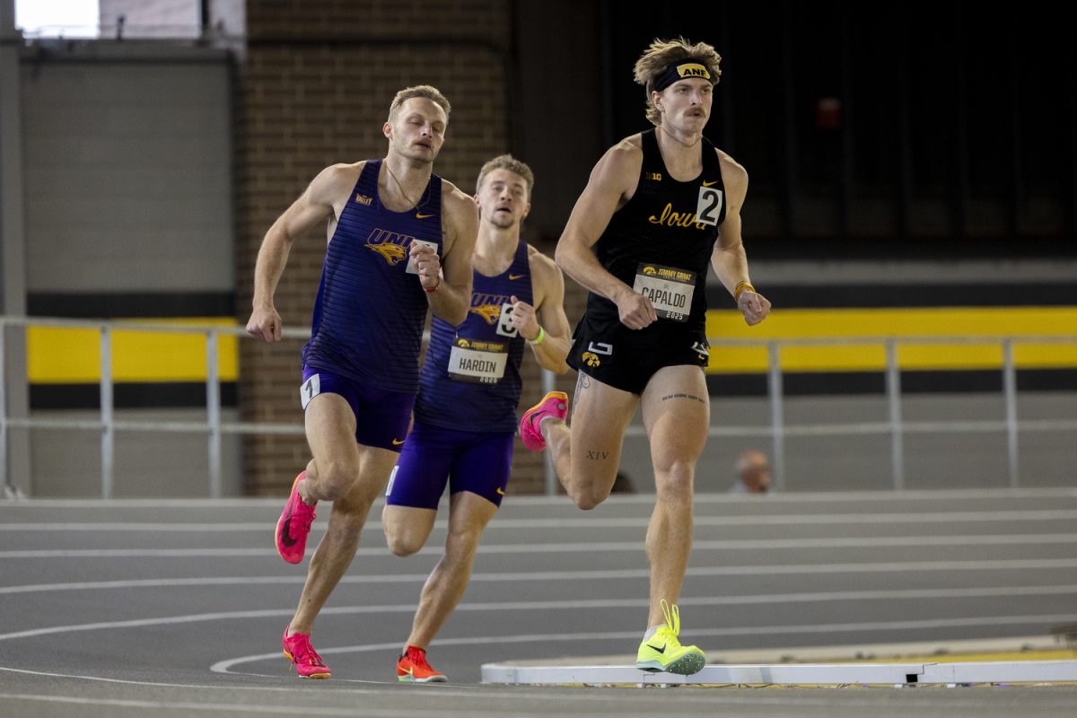 Iowa Hept 1000 meter runner, Sal Capaldo, maintains lead over Carter Morton and Tye Hardin during the track and field Jimmy Grant Invitational at the Hawkeye Indoor Track Facility in Iowa City, Iowa on Saturday, Dec. 13, 2025. Capaldo ran a 2:48.48, 1000 meter race and placed second for the Hawkeyes. The Hawkeyes hosted the universities of Central Iowa, Grinnell, Judson, Northern Iowa, South Central Iowa, Western Illinois, and William Penn.