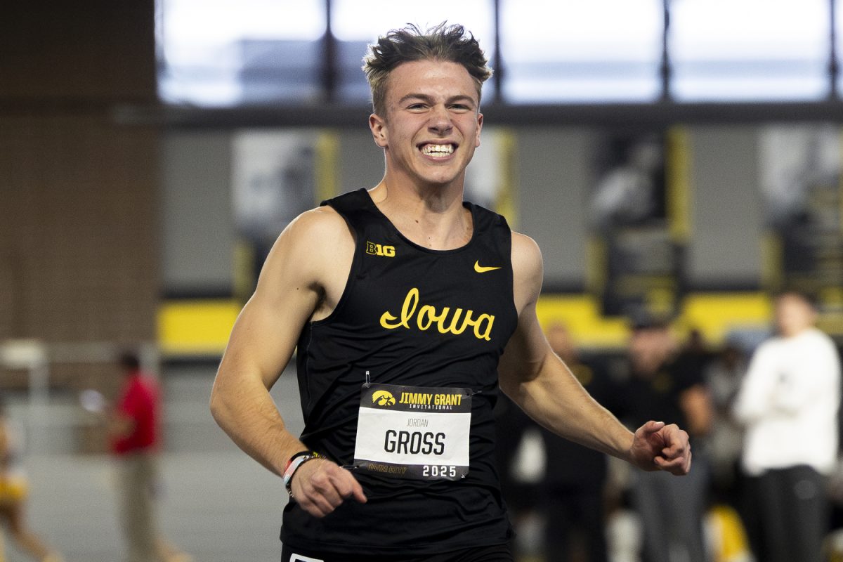 Iowa Men’s 60m Runner, Jordan Gross, smiles in celebration during the track and field Jimmy Grant Invitational at the Hawkeye Indoor Track Facility in Iowa City, Iowa on Saturday, Dec. 13, 2025. Gross placed third in the Men’s 60m Prelims with a 6.77. The Hawkeyes hosted the universities of Central Iowa, Grinnell, Judson, Northern Iowa, South Central Iowa, Western Illinois, and William Penn.
